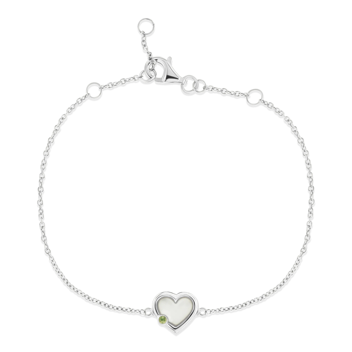 Silbernes Armband mit herzförmigem Anhänger aus Muttermilch-Kunstharz, verziert mit einem kleinen grünen Stein.