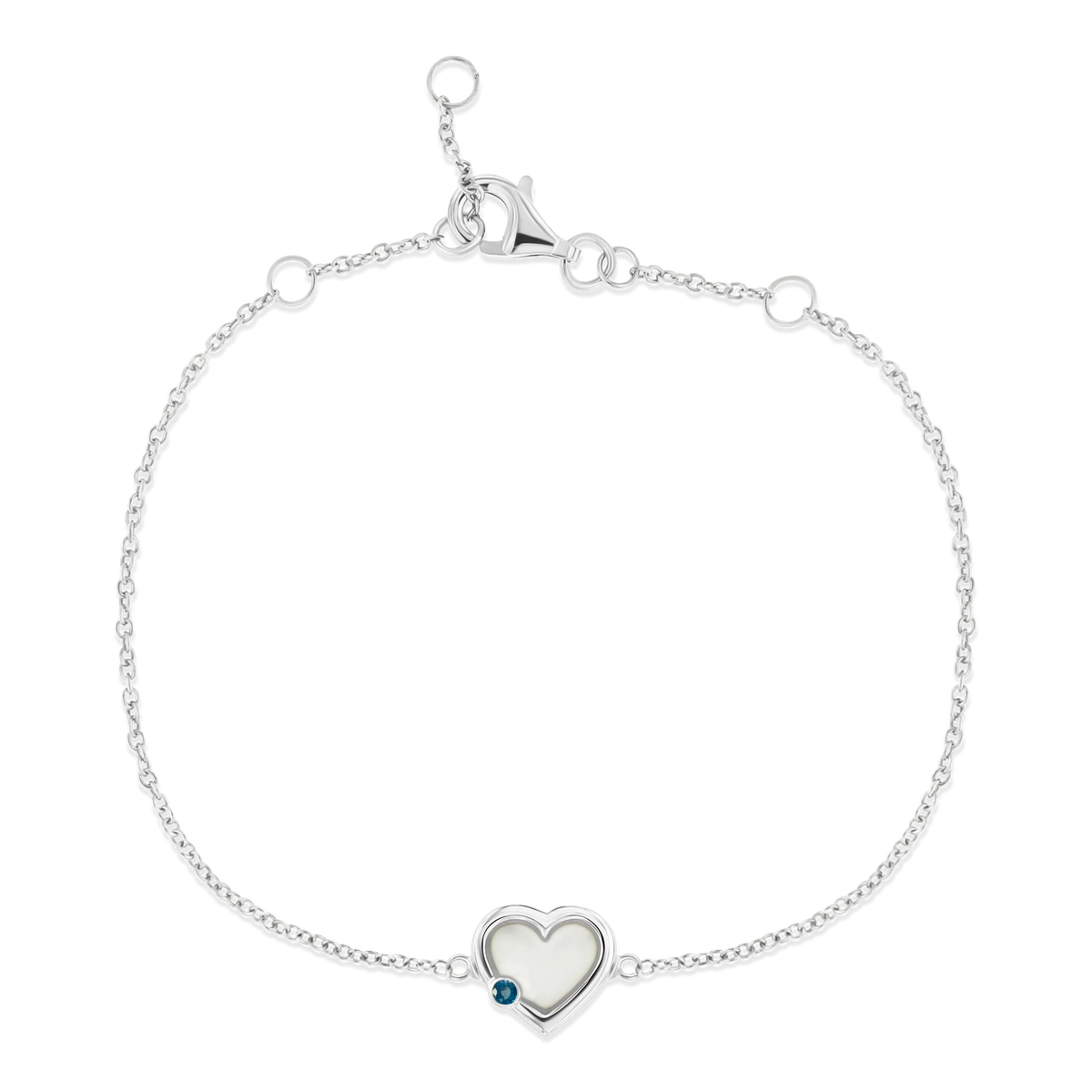 Silbernes Armband mit herzförmiger Fassung aus Muttermilch-Kunstharz und blauer Steinakzent.